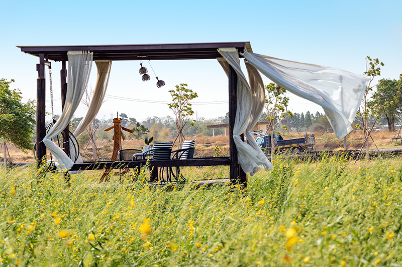 White,Curtain,On,A,Relaxing,Shelter,In,A,Meadow,Flutters